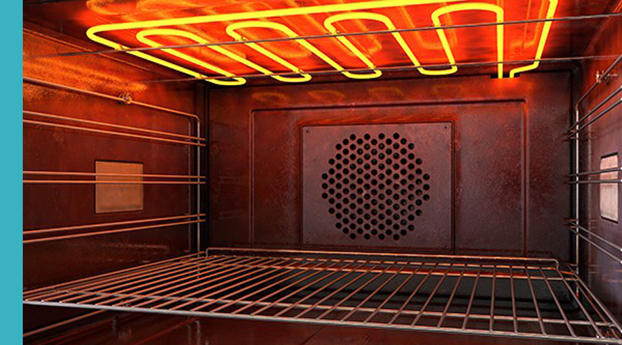 Interior of an oven with glowing heating elements on the top, showcasing the heat distribution.